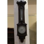 A carved oak thermometer and barometer marked Negretti & Zambra London 7919, 71cm high