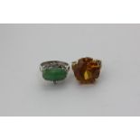 A jade and diamond dress ring, a citrine dress ring 4 claw set above a leaf