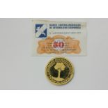 A 900 standard gold South American commemorative coin, 20g