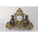 A 19th century gilt metal and bronze mantel clock by Raingo Fres A Paris, the circular dial with