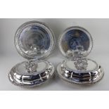 Two silver plated oval entree dishes of scalloped form, together with two circular trays