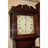 A George III longcase clock with 12 inch square white painted dial with floral spandrels, in oak