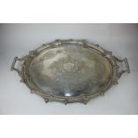 A Mappin & Webb silver plated oval scalloped tray with pierced gallery and scroll handles,