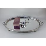 A Sheffield silver plated ladle in Asprey box, together with a large oval silver plated tea tray