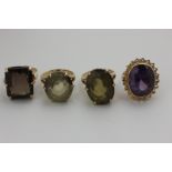 Four gem set dress rings in 9ct gold