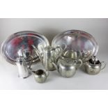An Asprey silver plated hot water pot, a four piece silver plated tea set with engraved floral