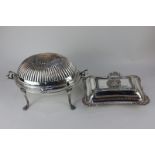 A silver plated oval breakfast warming tureen with revolving lid and lion paw feet, together with