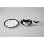 A Mintons gilt crested porcelain coffee cup and saucer with matching cake plate, decorated with blue