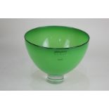 A Gillies Jones green glass pedestal bowl, with maker's label, signature to base, 15.7cm diameter