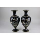 A pair of Victorian baluster vases decorated in the Chinese style with brightly enamelled humming