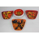 Three Delphis Poole Pottery trapezoid shape dishes on red and orange ground, together with a similar