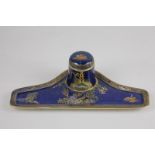 A Carlton ware Chinoiserie porcelain desk stand with inkwell, liner and cover, and polychrome and