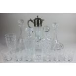 A silver plate mounted glass jug, five decanters, a set of six tumblers, and a vase