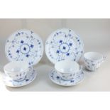 A Royal Copenhagen porcelain part tea set comprising two teacups, one coffee cup, two saucers, and