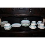 A Mintons porcelain part tea and dinner service with turquoise looped border on white ground and