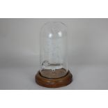 An Abbey Glass model of a three masted sailing ship under glass dome, on circular wooden base,