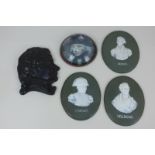 Three oval porcelain plaques depicting cameo profiles of Nelson, Wellington and Napoleon, on green