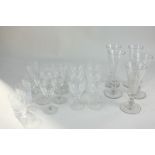 Five 19th century cut glass champagne flutes, seven Edwardian liqueur glasses, a set of six Webb