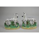 A pair of Staffordshire pottery zebras, 13cm high