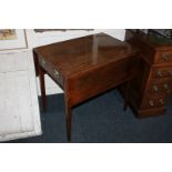 A 19th century Pembroke mahogany table with two drop flaps, drawer and opposing dummy drawer, with