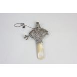 A Victorian silver and mother of pearl baby's rattle and whistle, embossed design, 'Hey Diddle