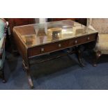 A Regency mahogany inlaid sofa table, the crossbanded top with conch shell patera, the two open