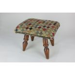 A 19th century elm footstool with studded needlework harlequin upholstery, on turned legs, 22.5cm