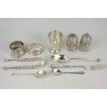 A Victorian silver salt and pepper, maker Horace Woodward & Co, London 1891, an egg cup and spoon,