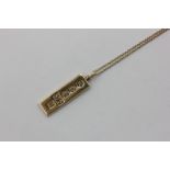 A 9ct gold ingot pendant on 9ct chain, 18.7g