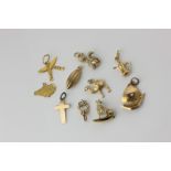 A group of gold charms, 14.6g, some mixed carats