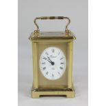 A Bayard brass carriage clock with oval dial and Roman numerals, movement stamped 7 Jewels,
