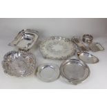 A collection of silver plated wares including two cake baskets, salvers, trays and dishes