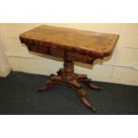 A 19th century inlaid mahogany rectangular shaped card table, the fold-over swivel top with rosewood