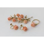 An 18ct gold and carved coral floral spray brooch, a matching ring, and a pair of screw fitted