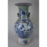 A Chinese crackle ware vase, baluster form, decorated in blue with birds and butterflies amongst a