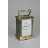 A gilt brass and bevelled glass cased carriage clock, the dial marked Mappin & Webb Ltd, 14.5cm