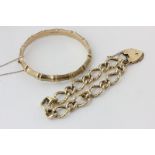 A 9ct gold 'bamboo' bangle, and a 9ct gold curb link bracelet with padlock clasp, 44.9g