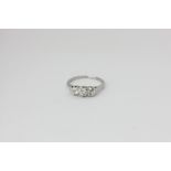 A diamond old cut diamond three-stone ring