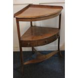 A 19th century mahogany corner washstand with replaced top, three dummy drawers, and uniting