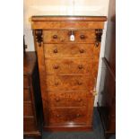 A Victorian walnut Wellington chest of six graduated drawers with turned knob handles, on plinth