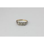 A diamond three stone ring in 18ct gold and platinum