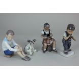 Three Dahl Jensen Copenhagen porcelain figures of a young girl holding a doll, 15.5cm, a boy playing