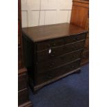 A 19th century oak chest of two short over three long drawers with brass drop handles, on bracket