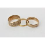 A 22ct gold wedding ring, 2.9g, two 9ct gold rings, 8.7g