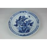 A Chinese porcelain blue and white charger depicting a bird amongst chrysanthemums, 30cm diameter