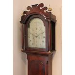 A George III flame mahogany longcase clock, the domed 12 inch dial with secondary dial and date