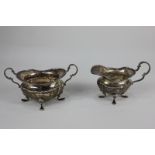 A Victorian silver cream jug and matched sugar bowl, makers Walker & Hall, Sheffield 1894 and