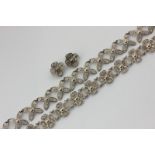 A Danish silver bracelet by Laurits Berth, each link as a four petal flower with wire work