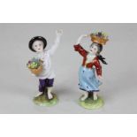 A pair of Rudolstadt Volkstedt porcelain figures of flower pickers, 9cm