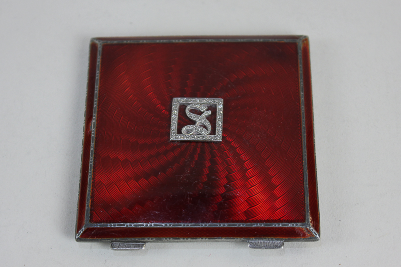 A George V silver and red guilloche enamel compact, makers Asprey & Co, Birmingham 1933, with rose